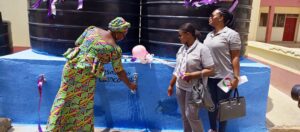 GRIDCo staff NAVASCO Headmistress during commissioning of 2 Mechanized Boreholes handing