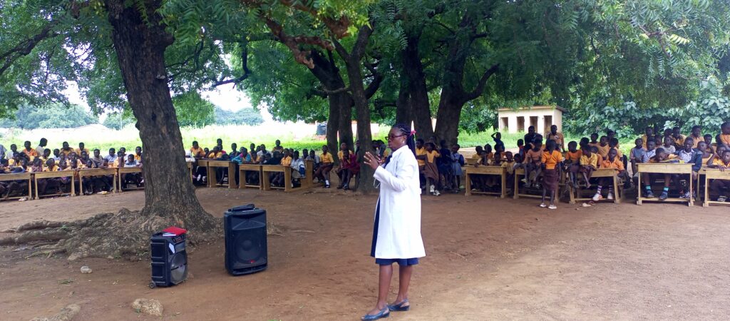 Doctor Bertha Volematome Gibil interacting with students during WOM career day