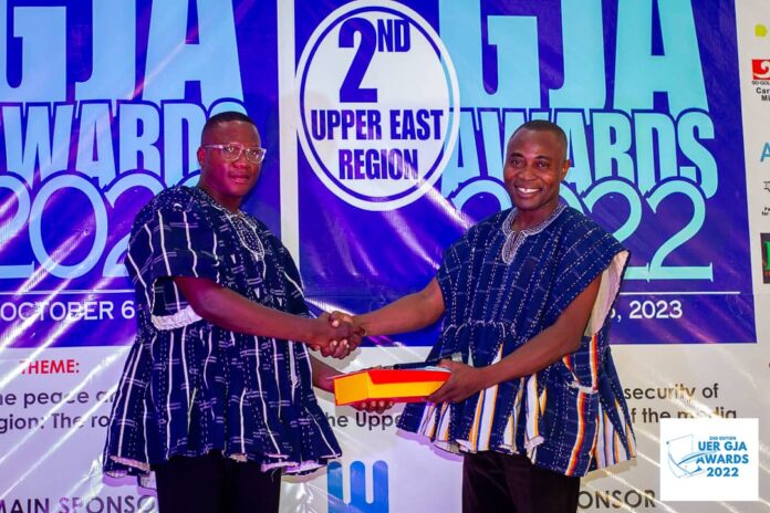 NICOLAS AZEBIRE RECEIVING AWARD AT THE 2ND EDITION OF THE UPPER EAST REGIONAL GJA AWARDS