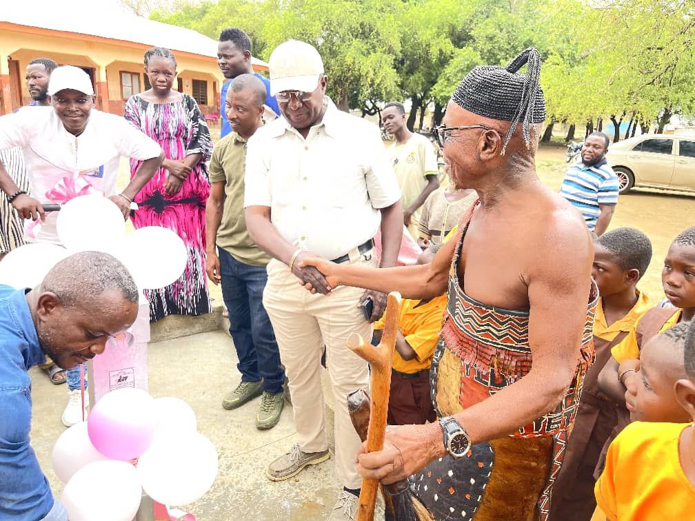 COP Patrick Akolgo and Tindaana of the area during handing over of the borehole