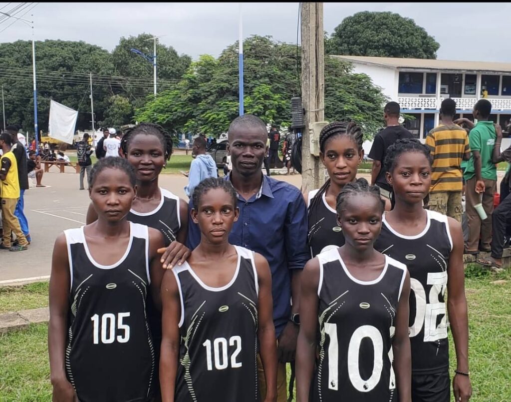 Eric Ayine Aloko with some of the athletic team members