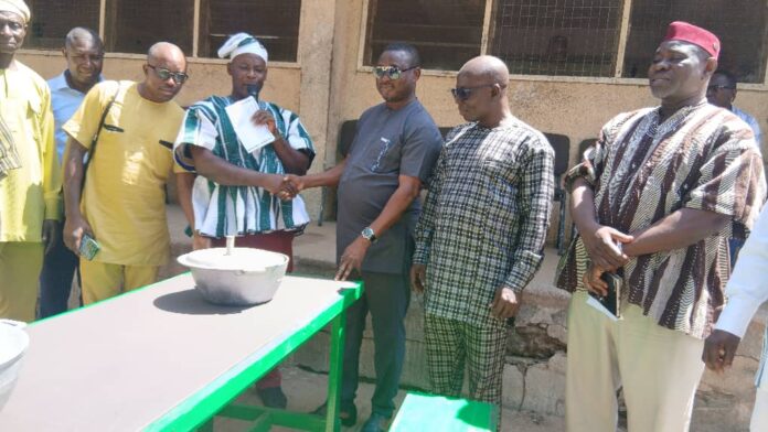 PTA leadership in handshake with MCE for Bolgatanga at handing over ceremony