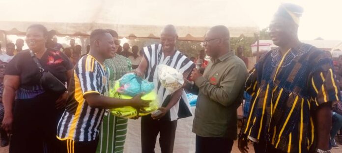 Member of Parliament for Bolgatanga Central Isaac Adongo (holding mic) hands jersey to participating teams